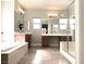Primary bathroom with double sinks, a soaking tub, and a walk-in shower at 12133 Vista Linda Ave, Las Vegas, NV 89138