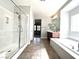 Spa-like bathroom with a large walk-in shower, soaking tub, and modern finishes at 12133 Vista Linda Ave, Las Vegas, NV 89138