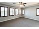 Spacious bedroom with plush carpeting and large windows with plantation shutters at 12133 Vista Linda Ave, Las Vegas, NV 89138