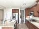 Modern kitchen with island, stainless steel appliances, and wood cabinets at 12133 Vista Linda Ave, Las Vegas, NV 89138