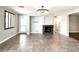 Open concept living area with fireplace and tile floors at 12133 Vista Linda Ave, Las Vegas, NV 89138
