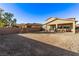 Large backyard with patio, swing set, and gravel at 1413 Fantastic Ct, North Las Vegas, NV 89081