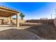 Backyard patio and grassy area with a swing set at 1413 Fantastic Ct, North Las Vegas, NV 89081