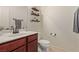 Convenient half bathroom with single sink and toilet at 1413 Fantastic Ct, North Las Vegas, NV 89081