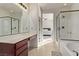 Bathroom with double vanity, large mirror, and walk-in shower at 1413 Fantastic Ct, North Las Vegas, NV 89081