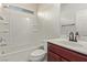 Clean bathroom with a shower/tub combo and wood vanity at 1413 Fantastic Ct, North Las Vegas, NV 89081