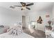 Bedroom with a large stuffed animal and ceiling fan at 1413 Fantastic Ct, North Las Vegas, NV 89081