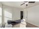Well-lit bedroom featuring a cozy bed and a door to another room at 1413 Fantastic Ct, North Las Vegas, NV 89081