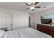 Bright bedroom with a queen bed and ceiling fan at 1413 Fantastic Ct, North Las Vegas, NV 89081