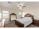Spacious bedroom with large bed, mirror, and ceiling fan at 1413 Fantastic Ct, North Las Vegas, NV 89081