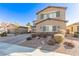 Two-story house with gray shutters, landscaping, and a driveway at 1413 Fantastic Ct, North Las Vegas, NV 89081