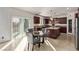 Kitchen with dark wood cabinets, granite counters, and an island at 1413 Fantastic Ct, North Las Vegas, NV 89081