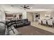 Living room with sectional sofa, dining area and kitchen views at 1413 Fantastic Ct, North Las Vegas, NV 89081