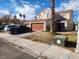 Two-story house with attached garage and desert landscaping at 1487 Elaine Dr, Las Vegas, NV 89142