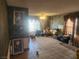 Living room with tiled floor, large windows, and various furniture at 1487 Elaine Dr, Las Vegas, NV 89142