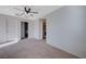 Bright bedroom featuring carpet, ceiling fan and access to laundry at 152 Belmont Canyon Pl, Henderson, NV 89015