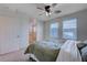 Bright bedroom with ensuite bathroom and ceiling fan at 152 Belmont Canyon Pl, Henderson, NV 89015