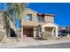 Tan two-story house with blue shutters and a brick walkway at 152 Belmont Canyon Pl, Henderson, NV 89015