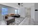 Open living room with L-shaped sectional and view of entryway at 152 Belmont Canyon Pl, Henderson, NV 89015