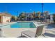 Community pool with lounge chairs and clear blue water at 152 Belmont Canyon Pl, Henderson, NV 89015