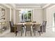 Dining room with seating for six, featuring a large window at 1549 Foothills Village Dr, Henderson, NV 89012
