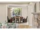 Formal dining room with large windows and classic decor at 1549 Foothills Village Dr, Henderson, NV 89012