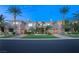 Beautiful home with a well-manicured front yard and palm trees at 1549 Foothills Village Dr, Henderson, NV 89012