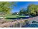 Scenic golf course view with lush greenery and mature trees, offering a tranquil and picturesque setting at 1549 Foothills Village Dr, Henderson, NV 89012