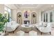 Elegant living room featuring a fireplace, stylish decor, and ample natural light at 1549 Foothills Village Dr, Henderson, NV 89012