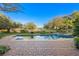 Inviting swimming pool and spa with patio, providing a serene backyard retreat with picturesque golf course views at 1549 Foothills Village Dr, Henderson, NV 89012