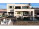 Luxury home with a large pool, outdoor seating, and a hot tub at 168 Still Shores St, Henderson, NV 89011