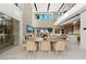 Spacious dining area with a large table and modern light fixtures at 168 Still Shores St, Henderson, NV 89011