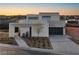 Modern two-story home with attached garage and landscaped front yard at 168 Still Shores St, Henderson, NV 89011