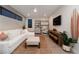 Bright Gathering room with sectional sofa and built-in shelving at 168 Still Shores St, Henderson, NV 89011