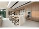 Modern kitchen with an island, stainless steel appliances, and light wood cabinets at 168 Still Shores St, Henderson, NV 89011