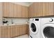 Modern laundry room with ample cabinetry and LG washer/dryer at 168 Still Shores St, Henderson, NV 89011
