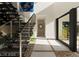 Modern staircase with a metal railing and stone flooring at 168 Still Shores St, Henderson, NV 89011