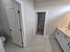 Clean bathroom with double vanity, toilet, and walk-in closet at 1770 Ironside St, Pahrump, NV 89048