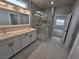 Modern bathroom with double vanity, large shower, and elegant tile at 1770 Ironside St, Pahrump, NV 89048