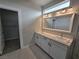Bathroom boasts double vanity, modern lighting, and large mirror at 1770 Ironside St, Pahrump, NV 89048