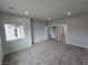 Spacious bedroom with neutral walls, carpet, and access to bathroom at 1770 Ironside St, Pahrump, NV 89048