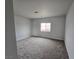 Spacious bedroom with neutral carpeting and large window at 1770 Ironside St, Pahrump, NV 89048