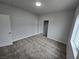 Spacious bedroom with plush carpeting and mirrored closet doors at 1770 Ironside St, Pahrump, NV 89048