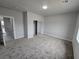 Bright bedroom with mirrored closet doors and carpet at 1770 Ironside St, Pahrump, NV 89048