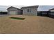 Newly built home with modern design and small patch of lawn at 1770 Ironside St, Pahrump, NV 89048
