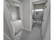 Hallway with bathroom and bedroom access; grey flooring at 1770 Ironside St, Pahrump, NV 89048