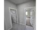 Hallway with doors to bedrooms and neutral decor at 1770 Ironside St, Pahrump, NV 89048