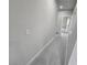 Bright hallway with grey wood-look flooring and neutral walls at 1770 Ironside St, Pahrump, NV 89048