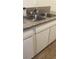 Kitchen features a double sink and white cabinets at 2517 Cedar Ave, Las Vegas, NV 89101