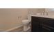 Clean bathroom with dark vanity and updated toilet at 2811 Shadows Edge Ct, Henderson, NV 89052